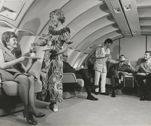Cropped Flight attendants serving drinks in aircraft cabin Digital Collection