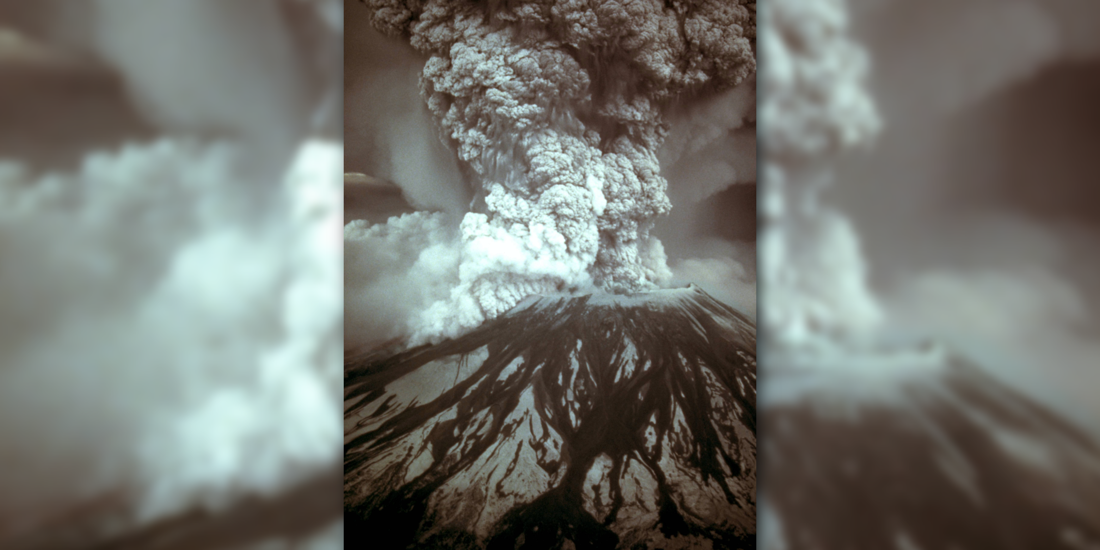 Featured image: Mount St. Helens erupts dramatically, sending massive smoke plumes into the sky. - Read full post: Heroes in the Ashes: Airborne Rescue and the Mount St. Helens Eruption