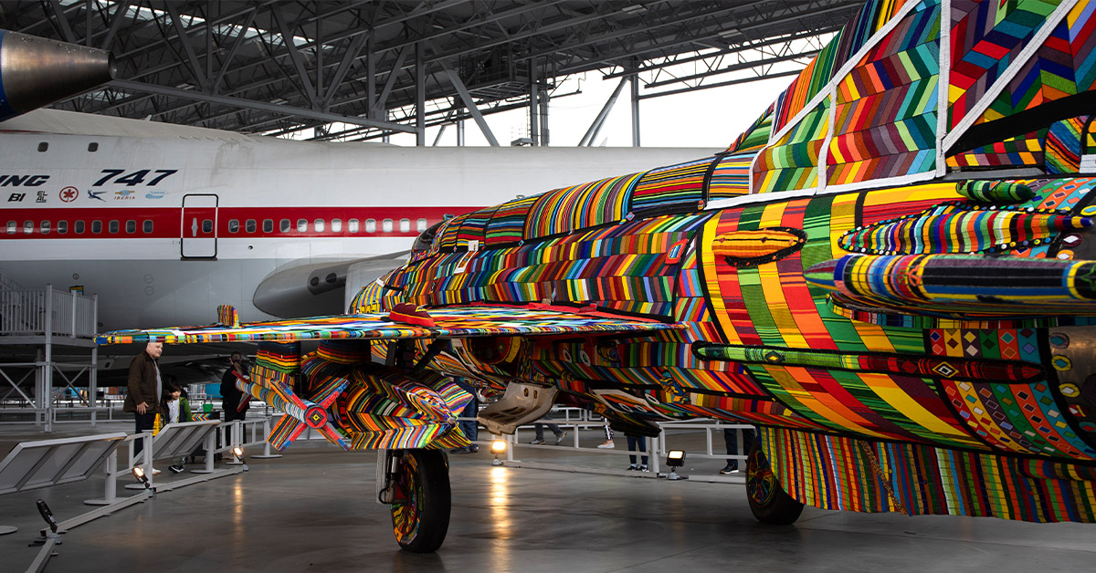 Featured image: View of the beaded MiG facing the 747 in the Aviation Pavilion at the Museum - Read full post: Quick Facts About The MiG-21 Project