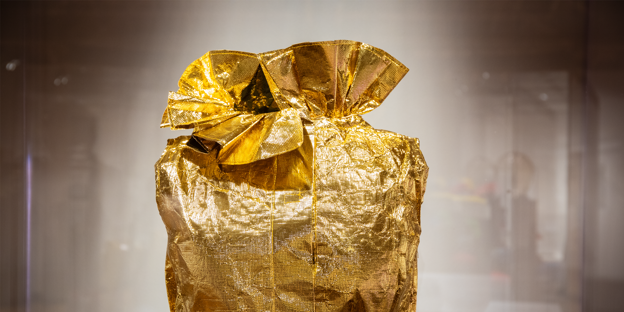 Featured image: TWA gold paper dress on display in the Runway to Runway exhibit. - Read full post: The Story Behind TWA's Paper Uniforms—And How They Backfired